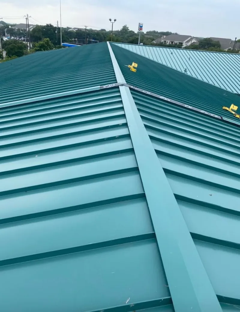 Green commercial metal roof ridge and valley for Metal Roof Repair in Kendall